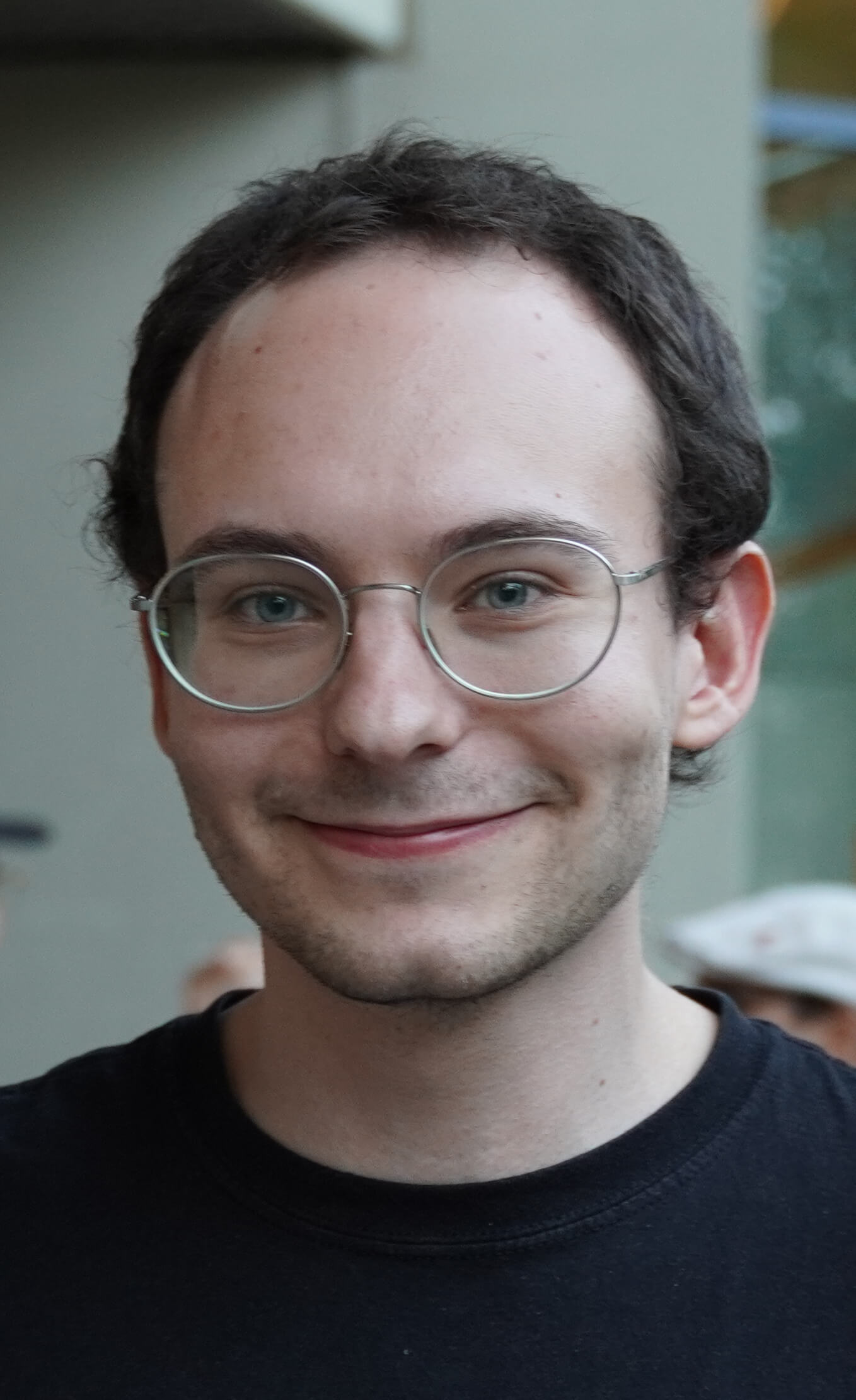 Photography of Markus Toran infront of the KIT-Department of Computer Science